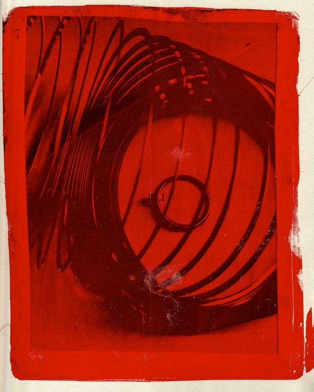 Ring inside a coiled spring, red print, Cartier Gelli Prints by David Spector