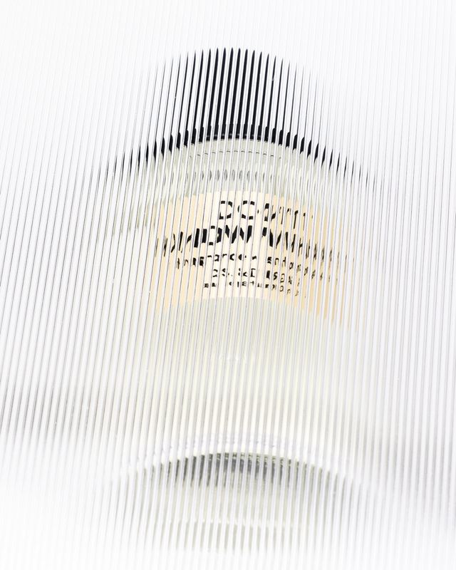 Bottle behind ribbed glass, D.S. & Durga by David Spector