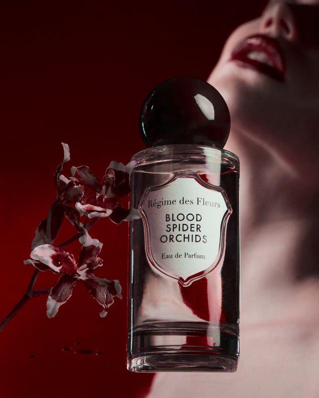 Bottle and orchid in front of a portrait, Blood Spider Orchids by David Spector
