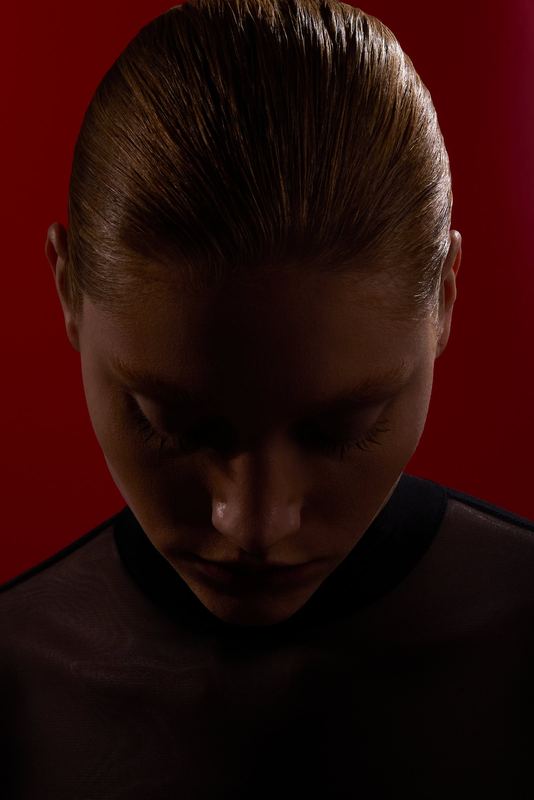 Portrait, head bowed in red light, Blood Spider Orchids by David Spector